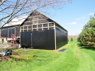Wiseline Diamond Rib Metal Siding Installed by Upright Construction Inc. based in Elgin County Ontario.